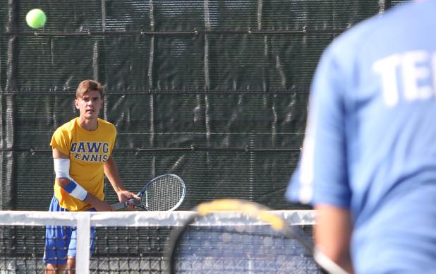 CCLP/TJ MAXWELL - Copperas Cove’s Trystan Jackson watches his serve during his doubles’ match with Nick Motley against Lampasas on Tuesday. Jackson and Motley won the match 6-2, 6-4 and also picked up singles wins for the team.