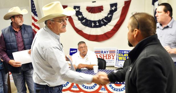 CCLP/LYNETTE SOWELL - W.B. Maples and Kyle Matthews shake hands after learning the results of the Tuesday primary election. The two now face each other in a runoff election set for May 24 for Coryell County commissioner precinct 1.