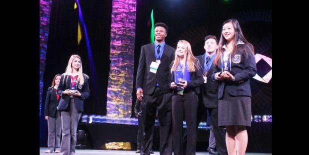 Copperas Cove High School DECA students Tariq Anthony, Rebekah Garris and Brandon Parton won top honors in the Entrepreneurship Business Growth Plan at the Texas DECA State Career Development Conference in San Antonio. DECA Executive Officer Victoria Meng, Southern Region Vice President, right, presented the award.
