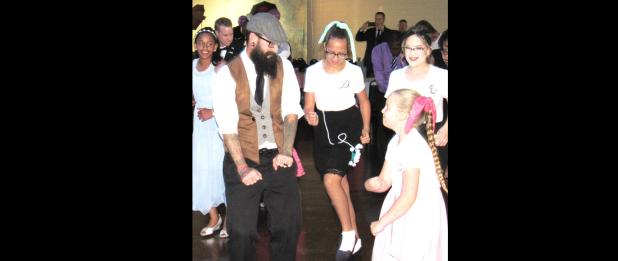 CCLP/BRITTANY FHOLER - Chris Bailey danced with his three daughters Danielle, Erin and Presleigh at the 3rd Annual Daddy Daughter Dance organized by the Parks and Recreation Department and the Youth Advisory Council, held at the Copperas Cove Civic Center Saturday evening.