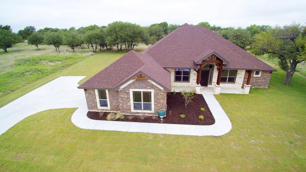 CCLP/GEORGE DUNCAN The four-bedroom, two-bath 2,489 square foot home located at 303 Skyline Dr is a Parade of Homes entry from Summers Homes.  This home has a rock and brick combo with an oversidzed two car garage with side entrance on just over half an acre.  