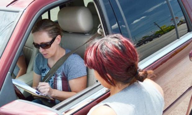 Jessica Dery collects a signature on the petition for the option to allow liquor and mixed drinks along Highway 190 in Copperas Cove. The Progress Cove group has collected over 1,000 signatures with a month left.