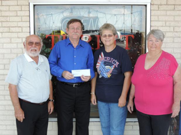 Optimist Club Past President Sandor Vegh; Friends of the Library President John Gallen; Club Manager Trish Lemire; and Optimist Club Member Sharon Sirianni Copperas Cove Optimist Club members present a $300 check to Friends of the Library to be used for purchase of new books for the Copperas Cove Public Library.