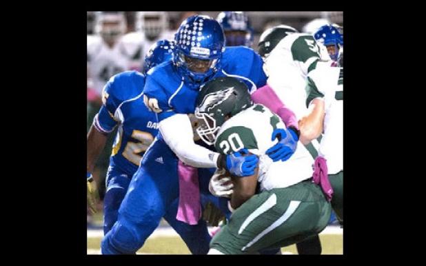Senior defensive end Shakanah Herrera tackles Ellison running back Deon Burch for a loss in the Bulldawgs 39-14 win over the Eagles. The Dawgs take on No. 13 Midway tonight in Waco.