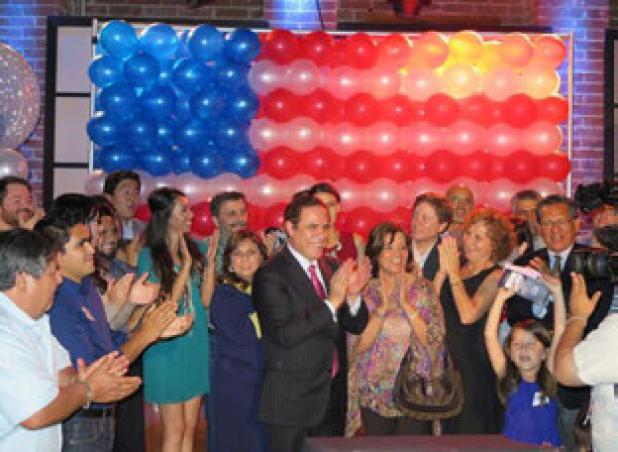 David Alameel celebrates with his campaign staff after hearing that he had won his race for Democratic nomination for the US Senate seat.