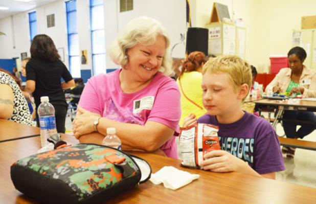 Nellie Twilleager enjoys spending time with her grandson, Eric Heriford, at Friday’s
Grandparents Day Lunch at Halstead Elementary.
