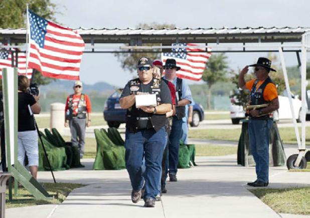 Greg Todd leads the procession as he delivers one of six unclaimed veterans to their final resting place, Wednesday at the Central Texas State Veterans Cemetery.