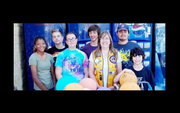 Members of the Copperas Cove Leo’s club pose for a group photo following their volunteer service in Killeen. The club collected funds for National White Cane day.