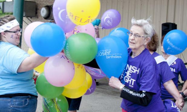 Supporters gather for the release of the Relay for Life survivors’ balloon
release Saturday at the Civic Center grounds