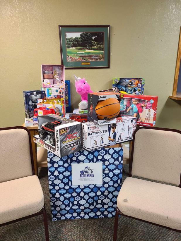 Gifts are stacked at a collection site during a past Christmas season. This year's application period for Cove Blue Santa is now open.