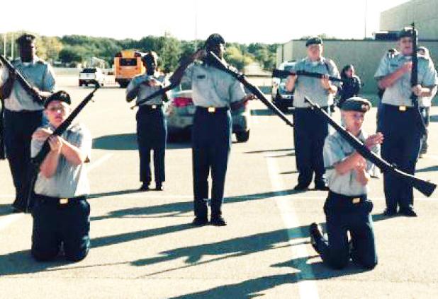 The Cove High JROTC Armed Drill Team puts in some last-minute practice time before Saturday’s competition in Fort Worth.