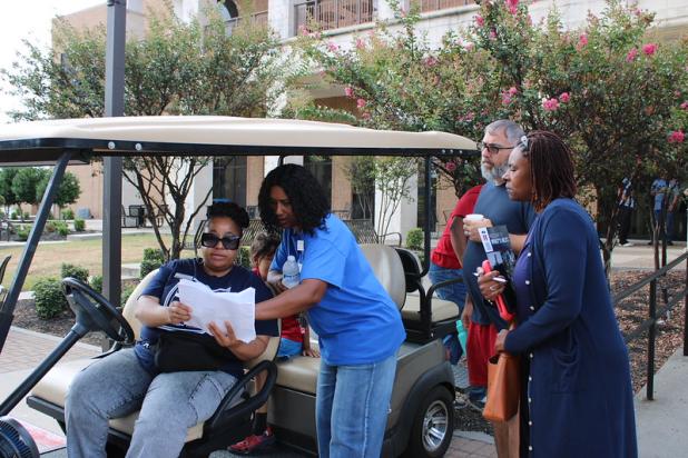 Central Texas College team members Lacriesha Wills and Erica Burton review the campus map with prospective students before escorting them to academic departments during Eagle Experience Day