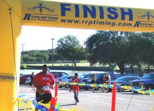 A runner makes his way towards the finish line during the 2013 Gallop or Trot 5K.