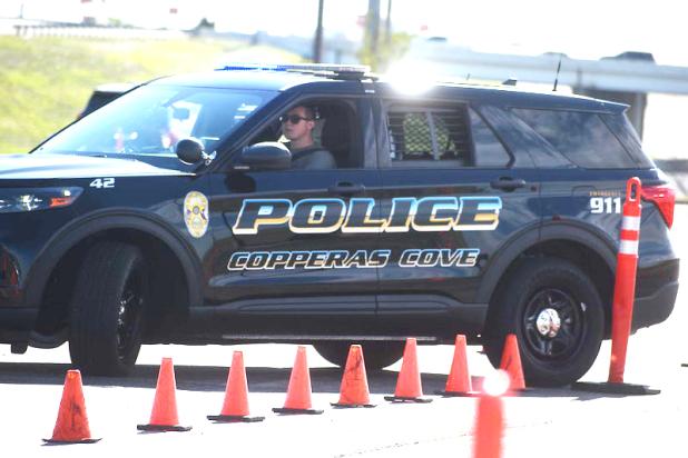 Copperas Cove residents Austin LeBel, Micah Burden, and Hasan Ibeljic maneuver a police department vehicle through the driving course at Central Texas College. The cadets are expected to graduate CTC on June 27 and join the local police force.