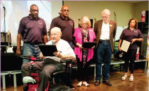 Copperas Cove Mayor John Hull is joined by representatives from Killeen and Harker Heights as he reads the proclamation from the city declaring June 28 as Star Group-Veterans Helping Veterans day.