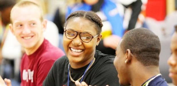 Copperas Cove’s Bryaunea Hall shares a laugh with Tyler King, left, and Danarius Brisbon, right, during a signing ceremony at Bulldawg Gymnasium on Wednesday.