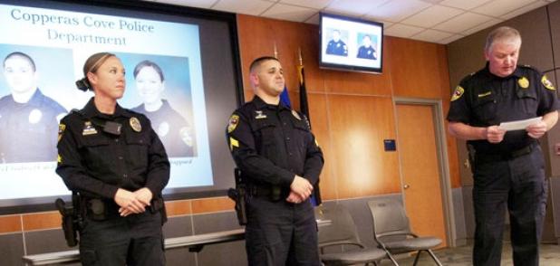 Copperas Cove Chief of Police Tim Molnes lists off the ccomplishments of Sergeant Gabriel Cardona, center and Corporal Christina Shappard during a promotion ceremony Wednesday afternoon.