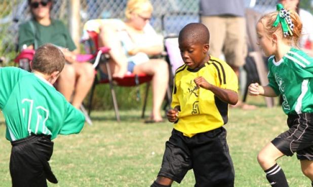 Ninjas’ Darrius Gray splits a pair of Minecraft Creepers defenders during their 9-under match up. Gray had one goal and one assist in the Ninjas’ 2-1 win over the Creepers on Saturday at Copperas Cove City Park.