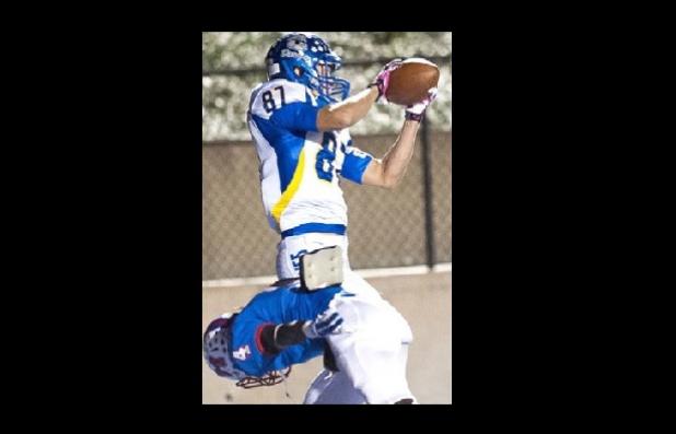 Tre Powell hauls in one of two touchdowns during his 12-catch, 151-yard performance on Friday.