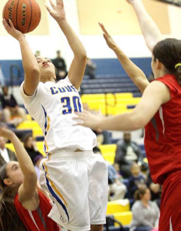 Cove senior Mikayla Blount shoots in traffic during their 51-42 win over Belton. The Lady Dawgs sit alone in third place at 5-3.