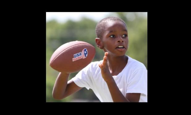 Eight-year-old Malik Davis competes in the NFL Punt, Pass and Kick competition Saturday at Copperas Cove City Park. Davis won the 8-to-9 yearold boys division.