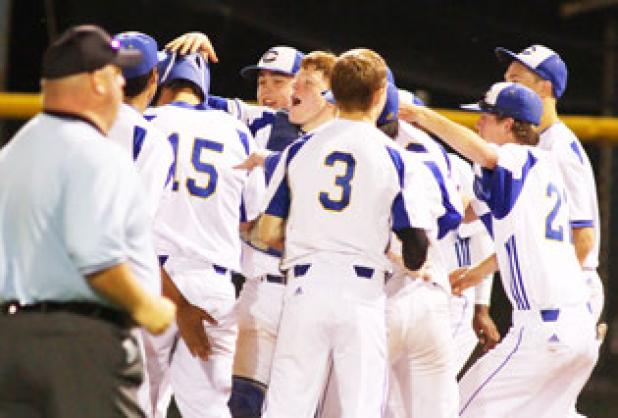 Copperas Cove senior Michael Sizemore, center, along with other teammates, congratulate senior Kyle Winstead (15) after connecting for a walk-off double to give the Bulldawgs a 10-0 victory over Temple on Tuesday.