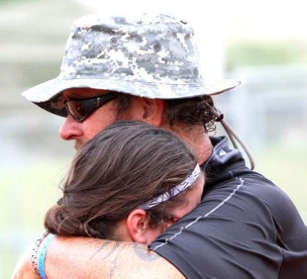Stephenville Crush head coach Jeff Pendleton shares an emotional embrace with his daughter Tayliegh after their team outlasted a pack of 21 teams to claim the 2014 Texas Teenage 12-under State Softball Championship on Thursday at Copperas Cove High School. The Crush went 6-0 in the tournament to win the title.