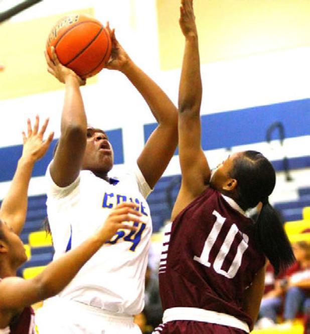 Copperas Cove sophomore Chyanne Chapman shoots over Killeen sophomore Shianne Johnson during their District 12-6A contest on Friday. The Lady Dawgs fell to the Lady Roos 56-50 after leading 40-31 mid-way through the third quarter.