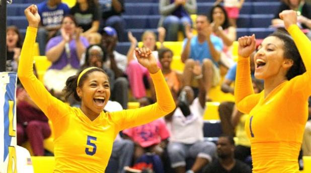 Copperas Cove junior Raven Dickerson, left, and senior Mikayla Blount celebrate a point during their 3-1 (20- 25, 25-7, 25-11, 25-12) win over the Hutto Lady Hippos Tuesday at Bulldawg Gymnasium. Dickerson led in kills with 12 and Blount led in assists with 25 and aces with five.