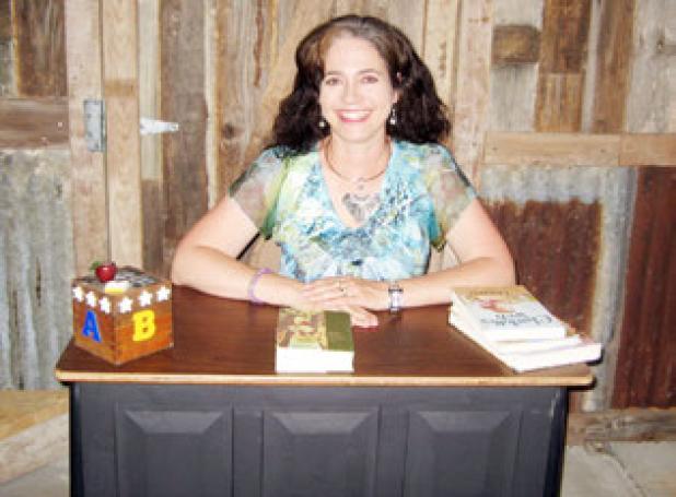 Cathy Traweek sits at her desk at the Five Hills Cowboy Church’s one-room school, set to open for K-3 in August.