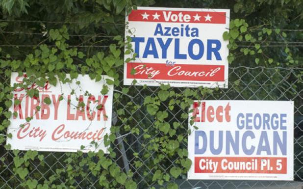 Campaign signs hang on a fence along Veterans Ave. The word “for” on the signs has become a hot topic between the candidates with Lack and Duncan both admitting they inadvertently left off the word.