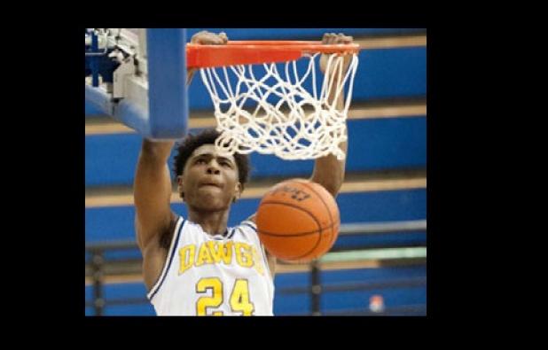 Cove senior Rashard Odomes dunks during their playoff game against Berkner. Odomes was named District 12-6A’s Most Valuable Player.
