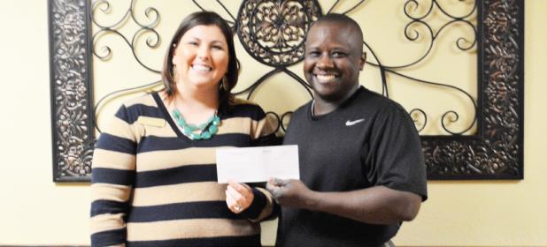 COURTESY PHOTO  - Christy Kirkpatrick, Marketing & Admissions Coordinator of Copperas Cove Nursing & Rehabilitation Center, and Heather Beaver, the center’s administrator, present a check for $250 to Brian Hawkins, executive director of Cove House Emergency Homeless Shelter, last Friday. The center’s parent company, Gulf Coast Long Term Care, selected the soup kitchen and Cove House for donations this year.