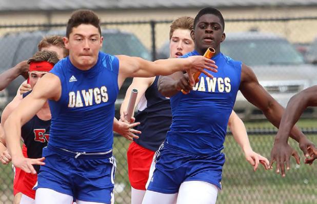 Copperas Cove dual-sport athlete Andrew Leuthner gets the hand off from teammate Justin Joe during 4x100- meter relay as part of the Eagle Relays in March.