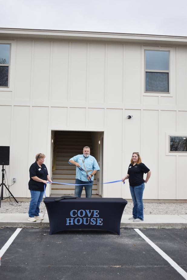 A 2024 ribbon cutting celebrates the expansion of Cove House Emergency Homeless Shelter.