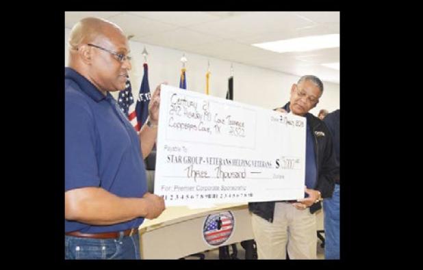 Star Group - Veterans Helping Veterans receives a check for $3,000 from Century 21 at their Saturday meeting.