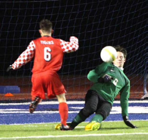 Cove goalkeeper Erik Frazer makes one of 14 saves made during the Bulldawgs’ 7-1 loss to Belton Tuesday at Bulldawg Stadium.