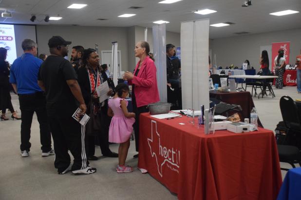 Job seekers speak with exhibitors at the Copperas Cove Economic Development Corporation’s Regional Hiring Event on Wednesday at the Copperas Cove Civic Center. 