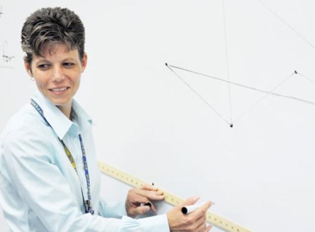 Yvonne Hoffchen, Elementary Teacher of the Year, works at the white board as she instructs. Hoffchen is an educator at Martin Walker Elementary School.
