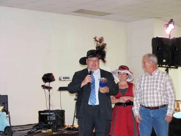 CCLP/PAMELA GRANT <br>  CCISD superintendent Joe Burns shows off an item during the live auction at the Boots & Buckles Gala. Money raised at the event goes to the Copperas Cove Education Foundation.