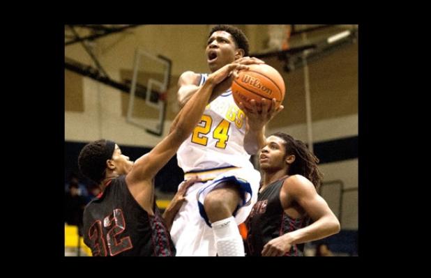 Cove shooting guard Rashard Odomes takes it to the hole against Harker Heights last year. The 6-foot-6, 195-pound senior recently verbally committed to play basketball for the Oklahoma Sooners in 2015.