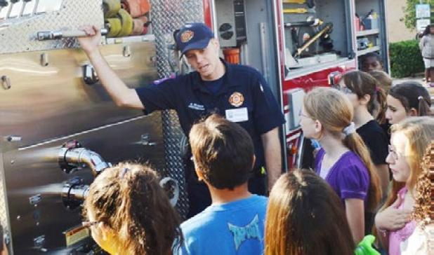 Matthew Musick with the Copperas Cove Fire Department tells fifth graders about the workings of Engine 2 at Friday’s Fire Prevention program at Halstead Elementary. 