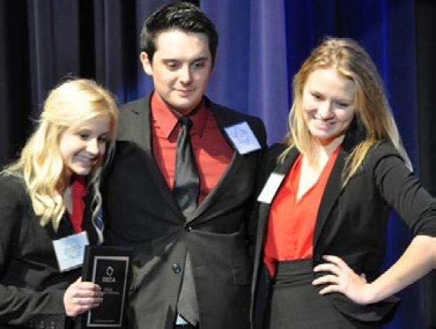 Caroline Darling, Brendon Thompson and Jennifer Kloesel are all smiles after receiving a high enough score from the judges to qualify the team’s Learn and Earn Project at the state level.