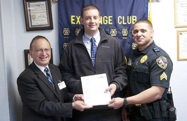 Joe DeCroce, left, presents Detective Rick Counter with the Officer of the Quarter award. Counter was nomintated by Sergent Gabriel Cardona for his investigative skills used in solving a kidnapping from Killeen.