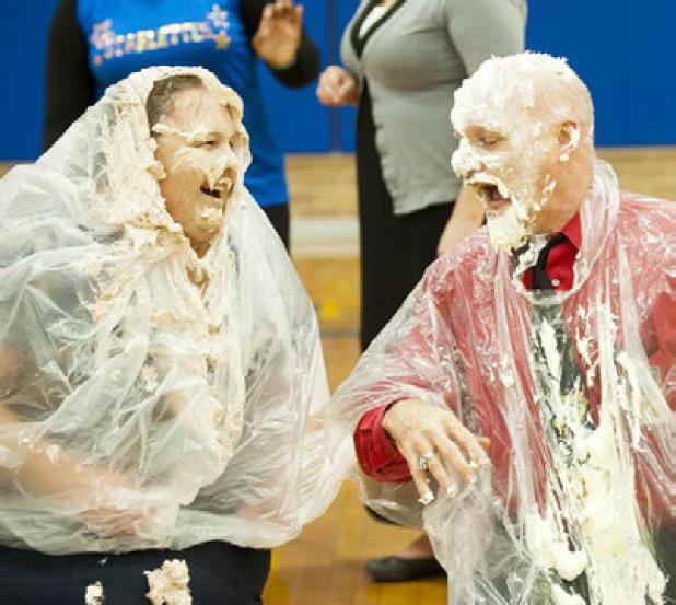 Copperas Cove Junior High sixth grade teacher Jennifer Wills is smashed in the face with a chocolate pie after she and fellow teacher Gene Turner collected the most funds for the annual United Way campaign on the campus.