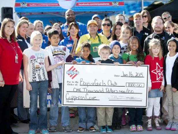 Representatives from the Copperas Cove Boys and Girls Club accept a $1,000 donation from Stripes Convenience Store during the grand opening celebration Friday.