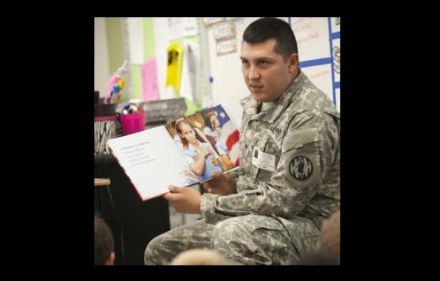 Sgt. Carlos Nesmith reads to students from House Creek Elementary as he helps them honor the memory of September 11, 2001.