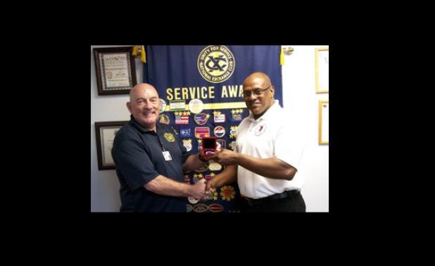 Mark Peterson presented Jonathan Haywood with an Exchange Club coin following his presentation on the SG-VHV annual report.