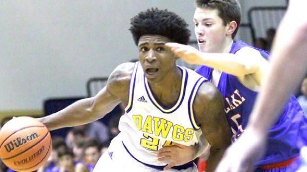 Copperas Cove senior Rashard Odomes drives against Westlake’s Joe Palmo during the Bulldawgs’ 69-60 win on Tuesday. Odomes shared game-high honors with fellow senior Chance Smith. Both guys scored 16 points to lead the Dawgs.