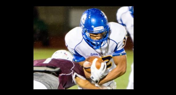 Copperas Cove linebacker/running back D’Mani Peapealalo fights through a Round Rock tackle during the Bulldawgs’ 26-0 loss to the Dragons Friday in Round Rock. Cove travels tonight to San Antonio to take on Schertz-Clemens.
